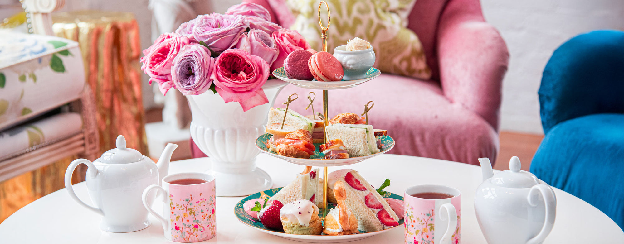 Three-tiered high tea service with tea sandwiches, scones, and French macarons in Salem & Beverly, MA